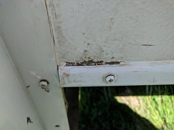 Cracks in the caulk of an RV slide out that is letting water inside.