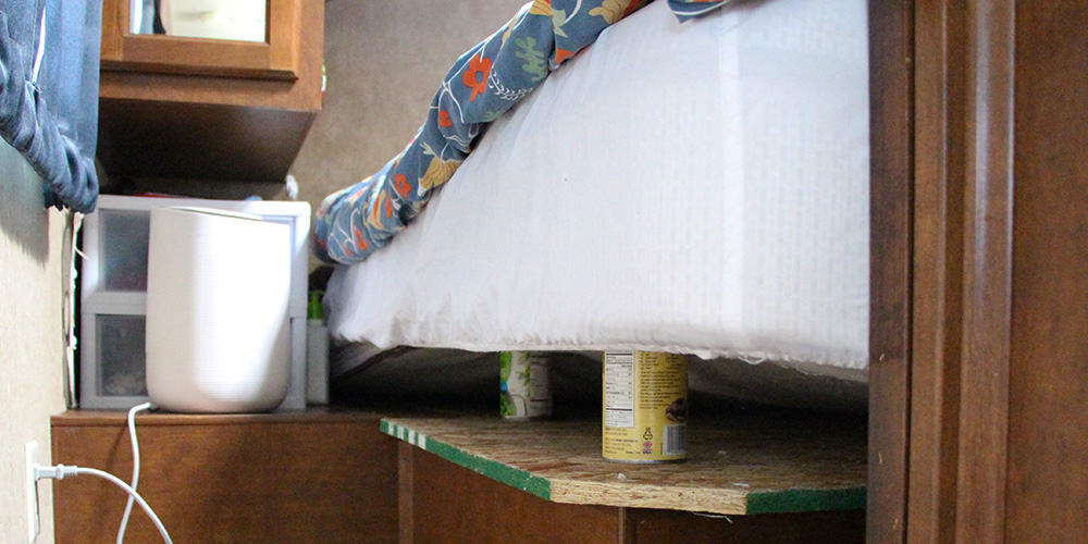 Place cans under the RV mattress to lift it up. Then use a fan or dehumidifier to dry.