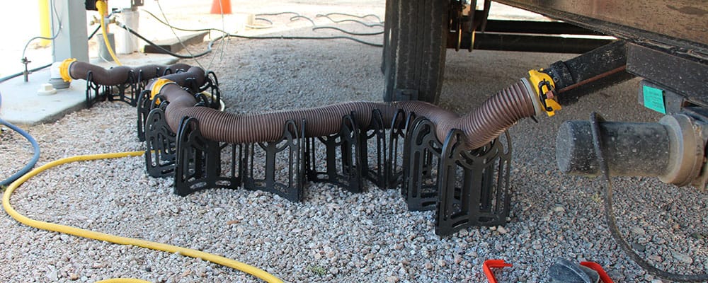 In many RV parks and campgrounds RV sewer hoses are required to be off the ground.