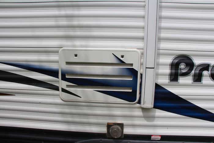 Outside RV fridge Access Door on a travel trailer with an RV fridge that won't cool