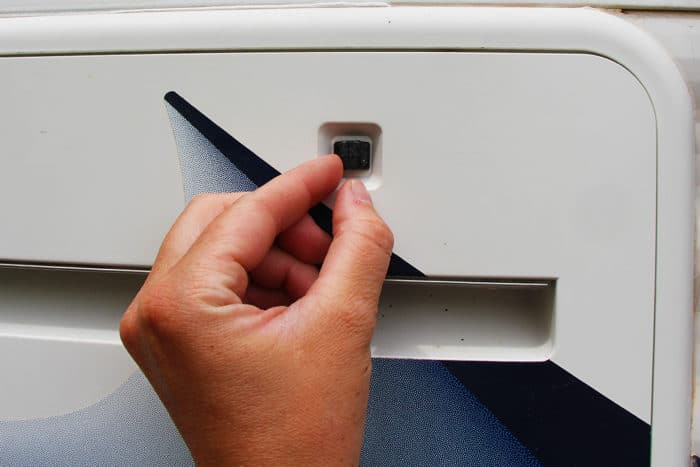 how to open the access panel on an RV fridge