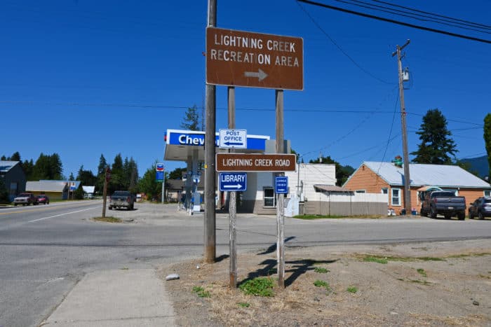 Sign in Clark Fork Idaho that shows the way to Lightning Creek Road camping area.