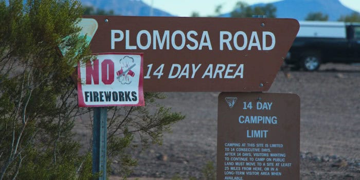 Plomosa Road entrance sign in Quartzsite Arizona.