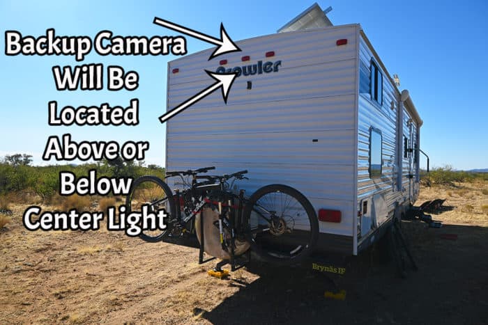 An RV Backup Camera is normally located above or below the center running light on the back.