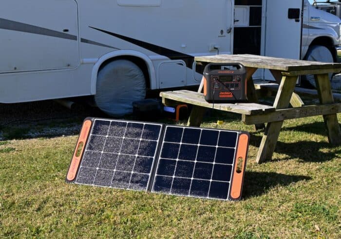 portable power station solar generator being charged by a portable solar panel