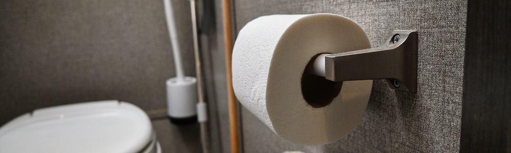 roll of septic safe rv toilet paper in a travel trailer bathroom