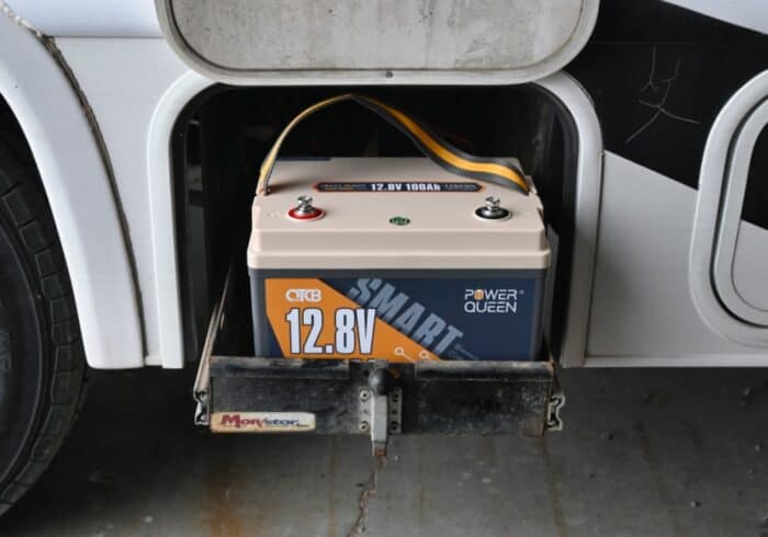 power queen lithium rv battery being installed in a motorhome to run the RV furnace