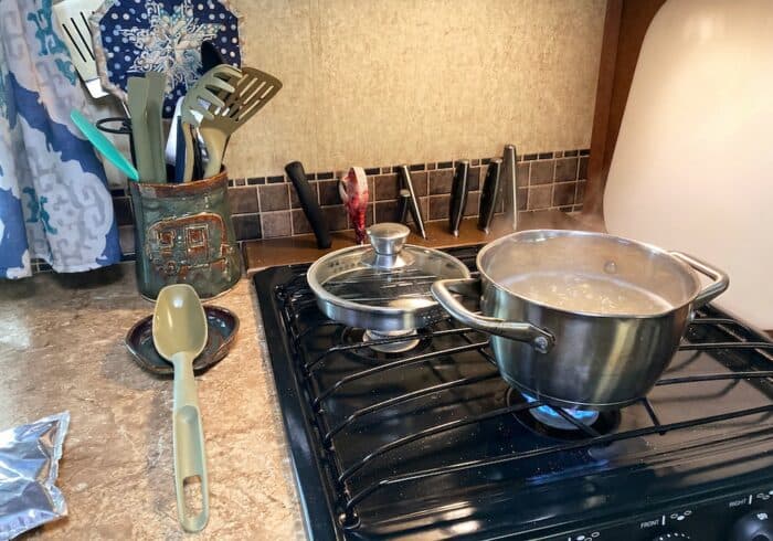 using rv kitchen accessories for full time rv living to cook in a camper