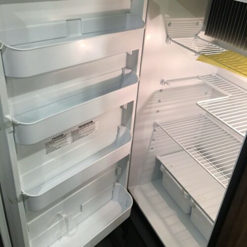 rv fridge with no rv kitchen accessories inside to help keep it organized