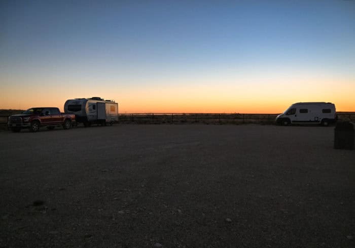travel trailer and van camped along the fence at the sunset reef campground near carlsbad caverns national park new mexico