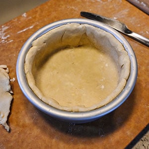 pie crust inside a pan for a small air fryer