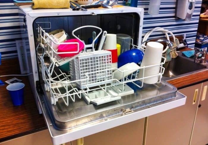 small portable RV dishwasher on the countertop in a camper kitchen