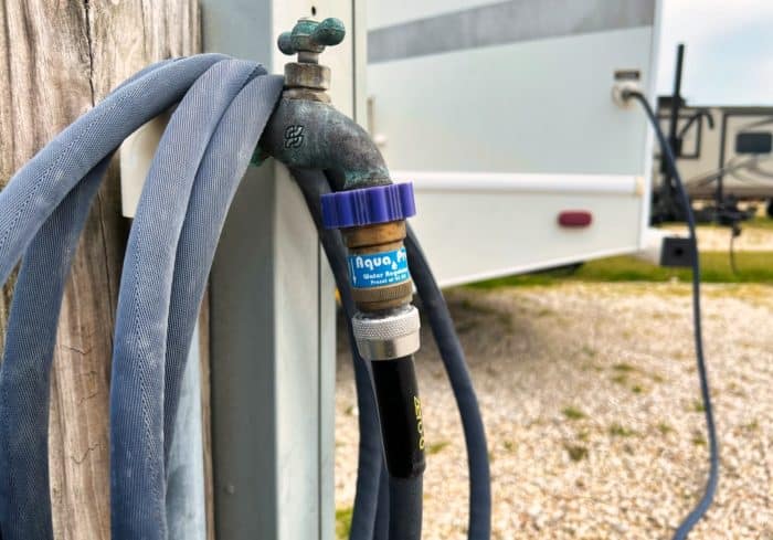rv water pressure regulator connected to rv park water hookup and rv