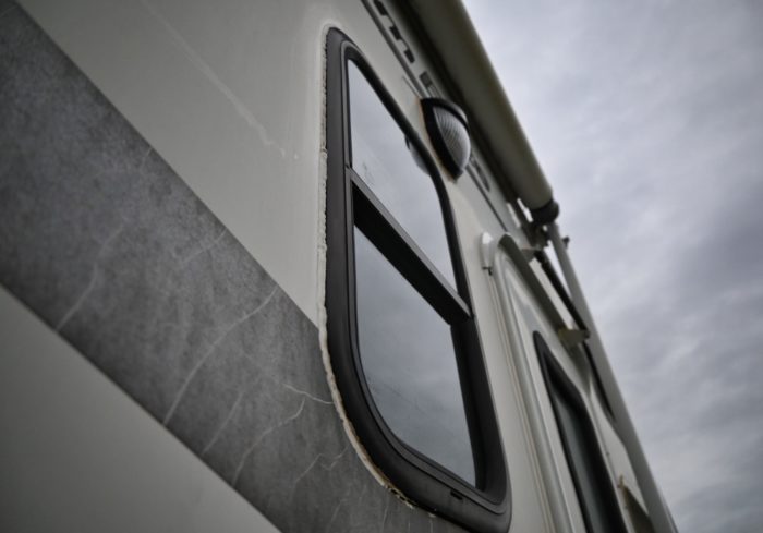 camper window with good rv caulk and sealant around the trim