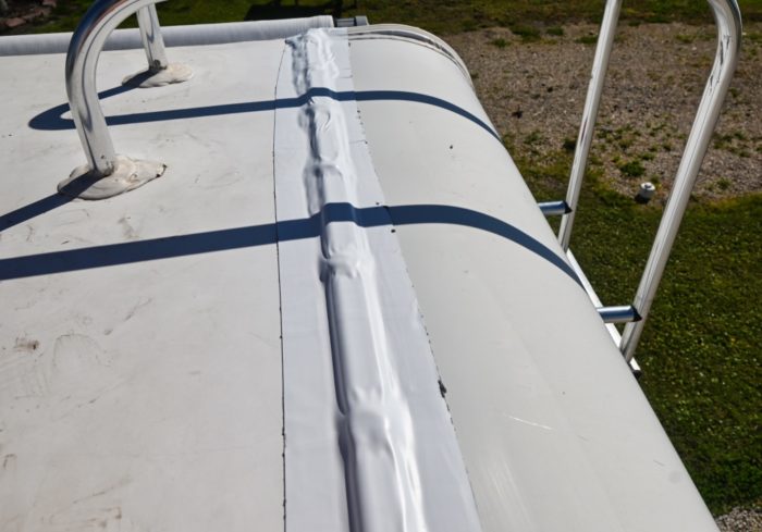 EternaBond on the rear termination bar of an RV rubber roof that needed to be resealed