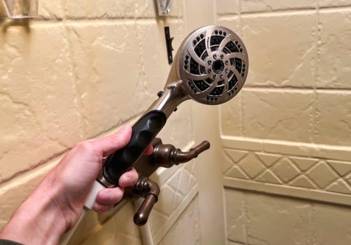 pressure increaseing rv shower head for showering with an rv water pressure regulator set to the correct pressure