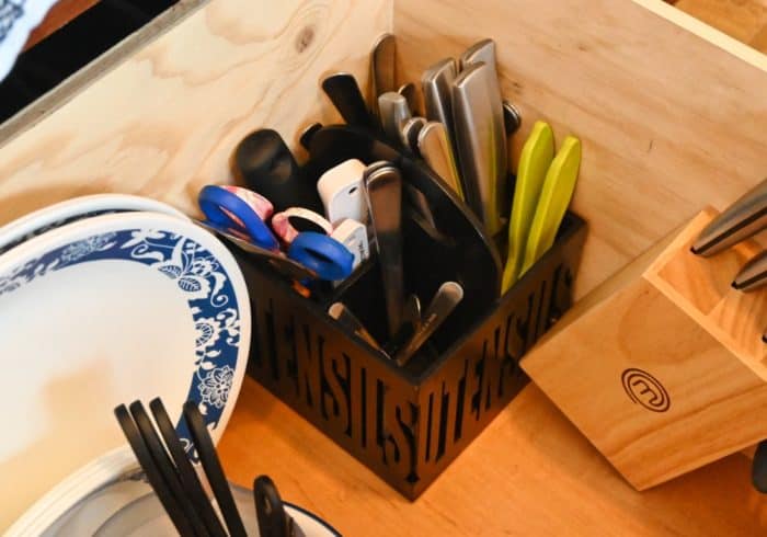 utensil holder caddy inside an RV drawer to help organize a tiny rv kitchen