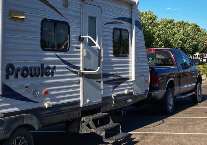 travel trailer in a parking lot with the same rv door keys as other rvs