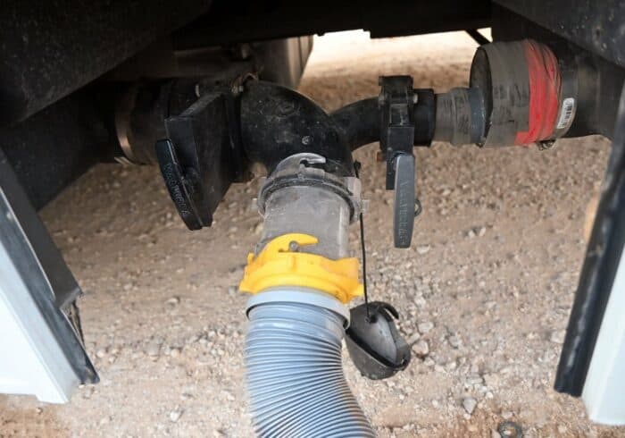 frozen rv drain pipe that's connected to the black and grey tanks on a motorhome