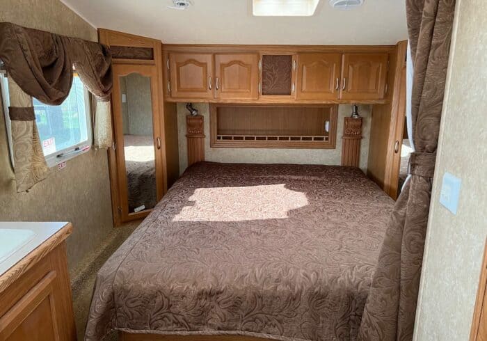 camper queen mattress in a 5th-wheel rv with a heated rv mattress pad to stay warm