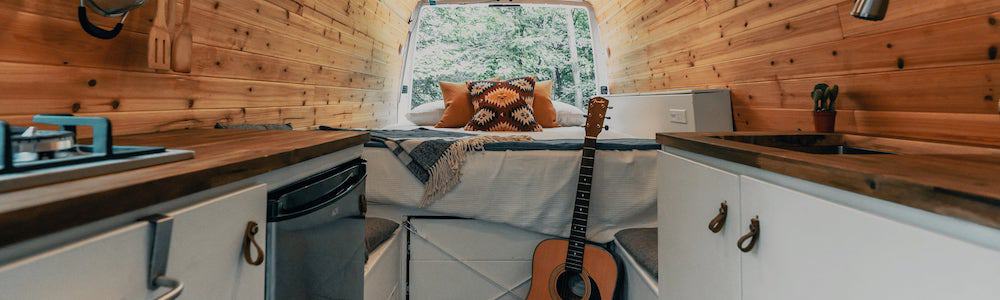 camper van with a short camper queen and a heated rv mattress pad for warmth