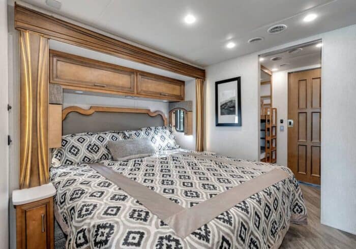king size rv bed in a class a motorhome with a heated rv mattress pad to stay warm at night
