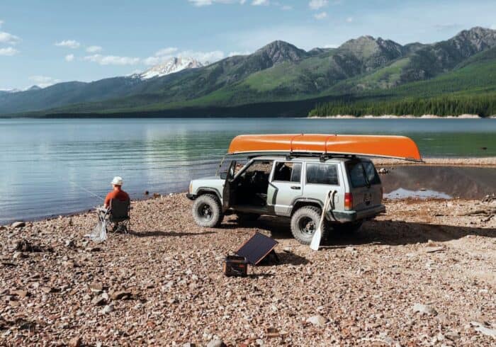 jackery 160 portable power station being used for outdoor camping and fishing