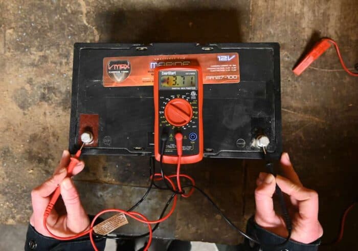 12 volt AGM deep cycle RV battery sitting at 13.7 volts after being charged by the NOCO Genius 5 amp smart charger