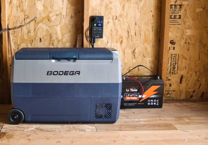 powering the bodega porable fridge using a 12 volt lithium battery, a battery socket outlet, and the included 12 volt power cord
