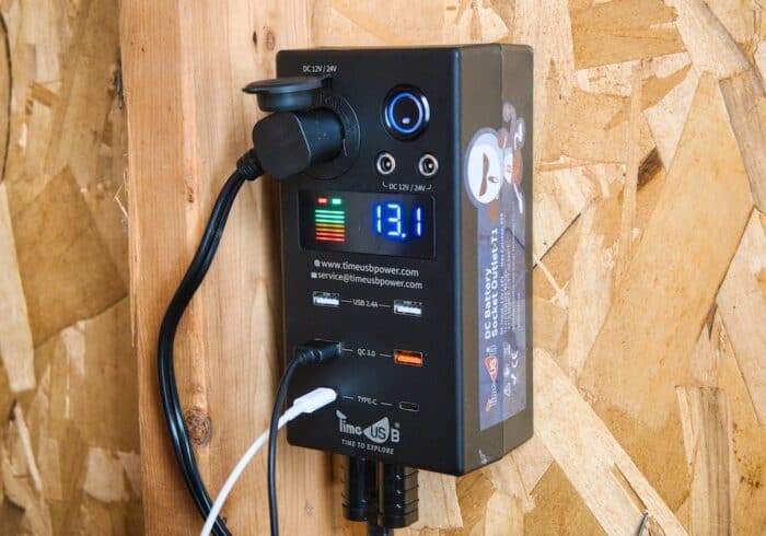 timeusb 12 volt battery dc usb hub mounted to the wall of an off grid cabin