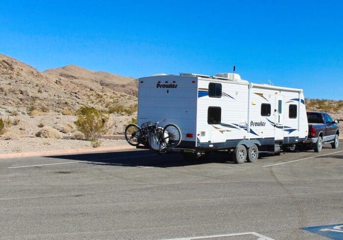 bikes mounted to a travel trailer using a spare tire bumper mount rv bike rack