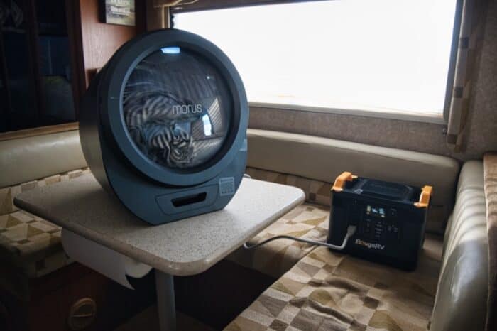 morus portable dryer plugged into a portable power station inside an rv