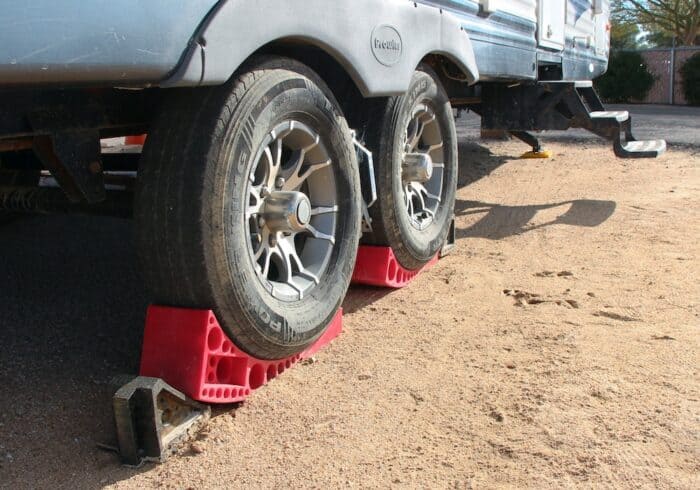 rubber wheel chocks and xchocks on a travel trailer rv 