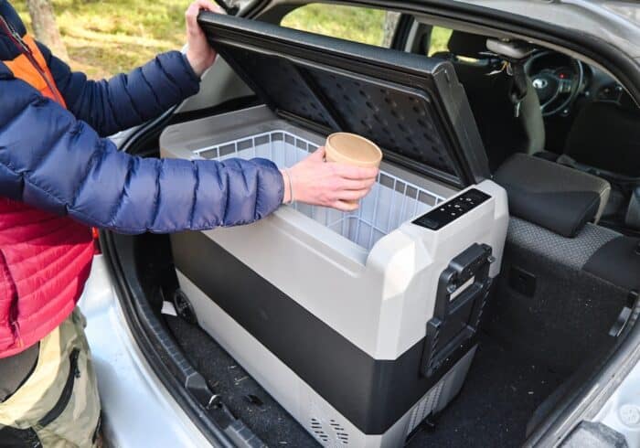 vevor portable fridge freezer 12 volt refrigerator in the trunk of a car with ice cream