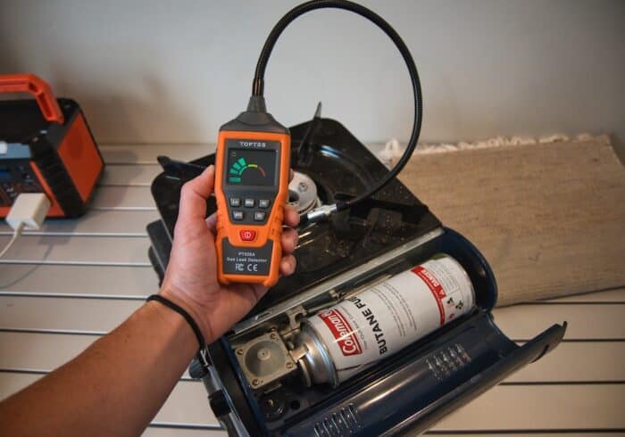 gooseneck TopTes gas detector being used to find a butane leak in a camping stove.
