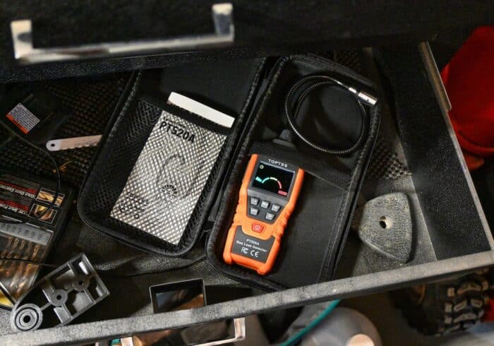 TopTes portable gas leak detecor in the included storage case in a tool box