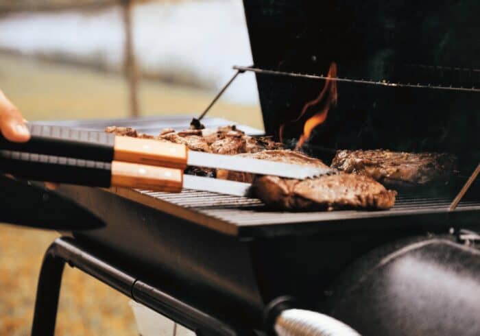 portable tabletop propane grill being used while rv camping