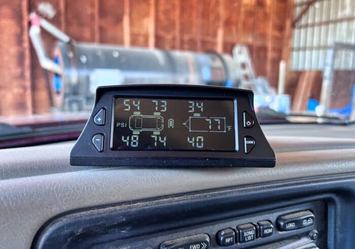 GUTA solar rv tire pressure monitoring system monitor inside a truck towing a trailer.