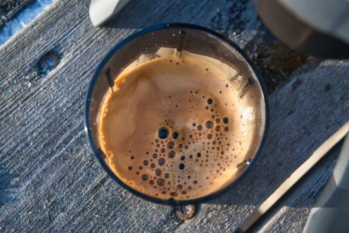 crema and espresso brewed while hiking with the Conqueco portable battery powered espresso coffee maker machine