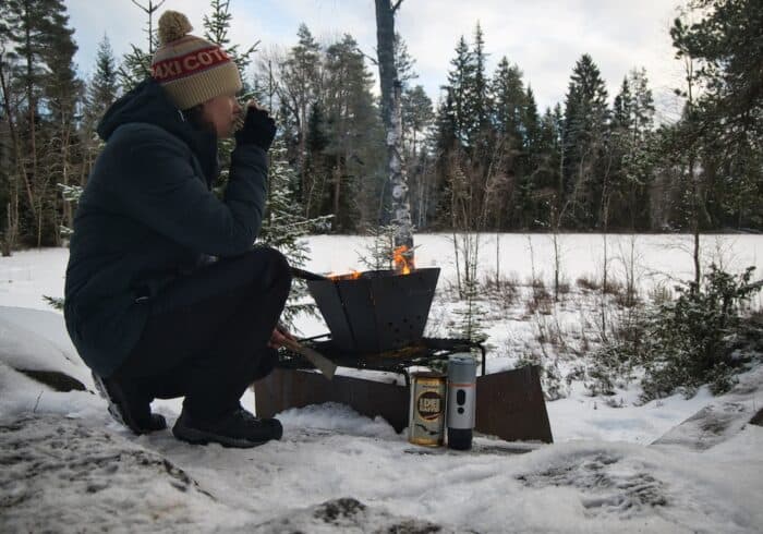 Using CONQUECO portable espresso maker at camping site next to a fire in the winter time.