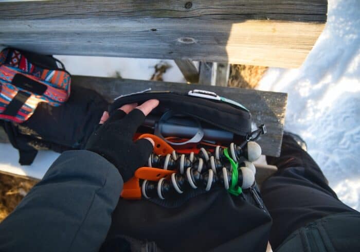 stand for the Conqueco portable coffee maker packed away in a daypack during a hike