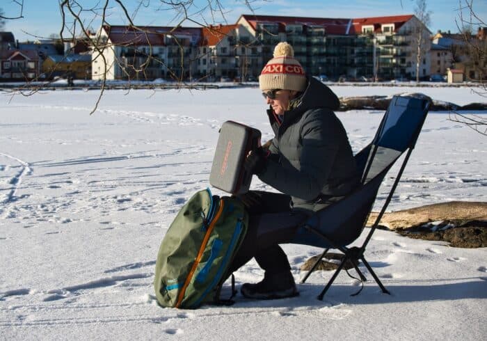Conqueco portable battery powered coffee maker inside it's carry case on a backpacking ice fishing trip. 